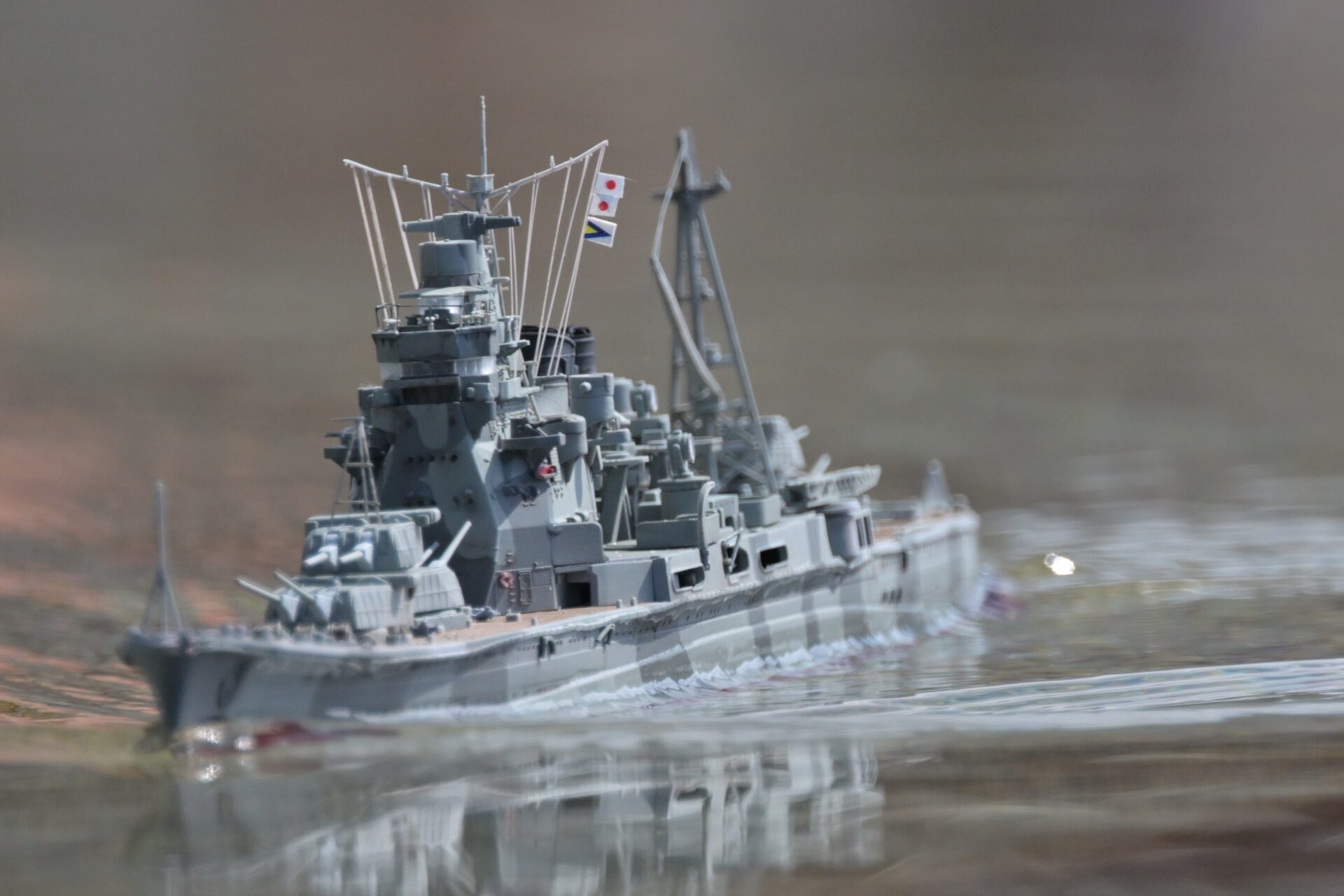 1/350 scale RC model of Japanese heavy cruiser Takao (Aoshima) running on Yamato Pond, painted in the Godzilla Minus One camouflage scheme.