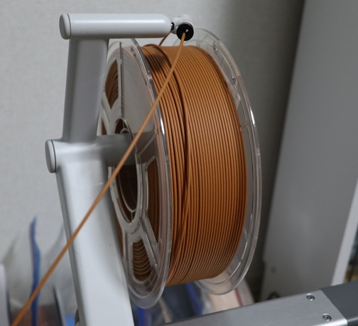 Wood PLA filament loaded on a Bambu Lab A1 3D printer