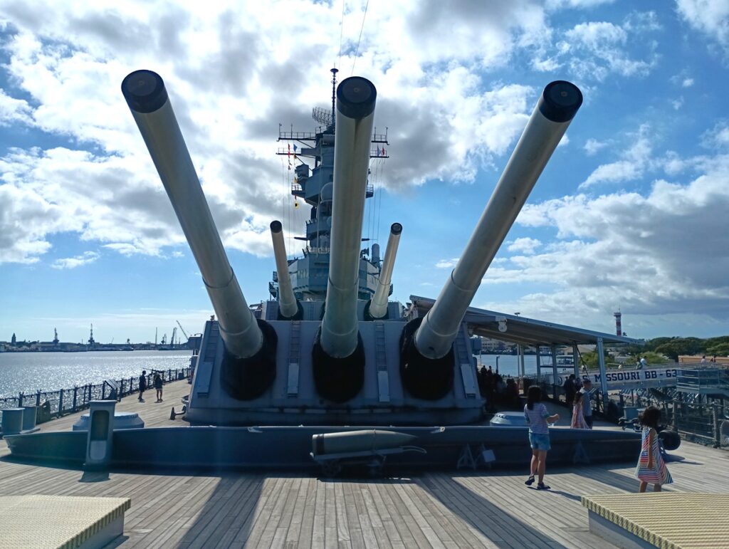 Naval gun monument photographed at a port, representing the From ports around the world travel log section.