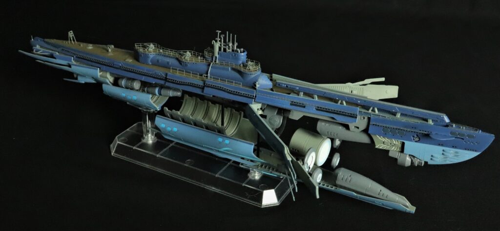 Right-side view highlighting the superstructure and wave-motion engine glow.