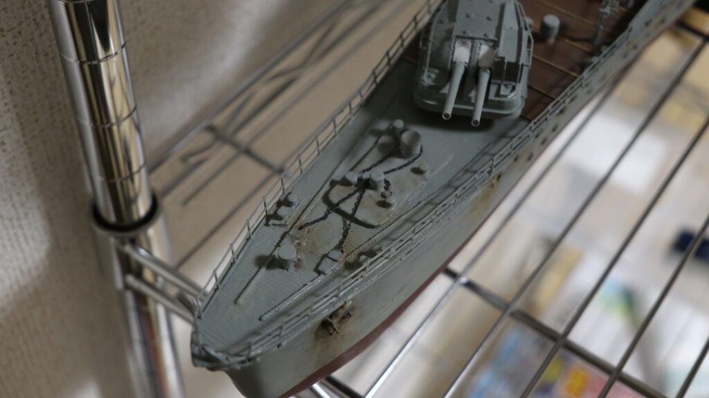 Close-up of a 1/150 IJN destroyer Yukikaze bow deck showing layered 3D print steps blended with a thin epoxy putty coat before final finishing.