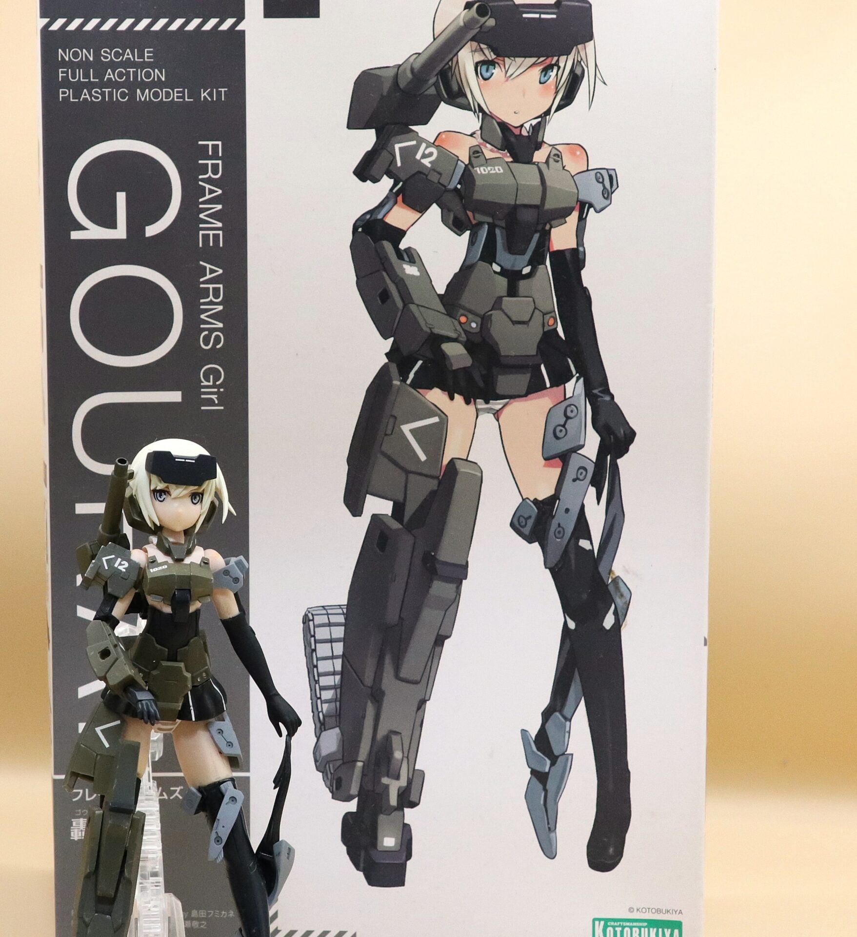 Frame Arms Girl Gourai kit box side artwork with the completed model standing beside the package.