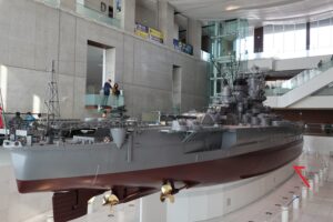 Museum-scale model of battleship Yamato highlighting the bilge keel location along the lower hull (marked with an arrow).