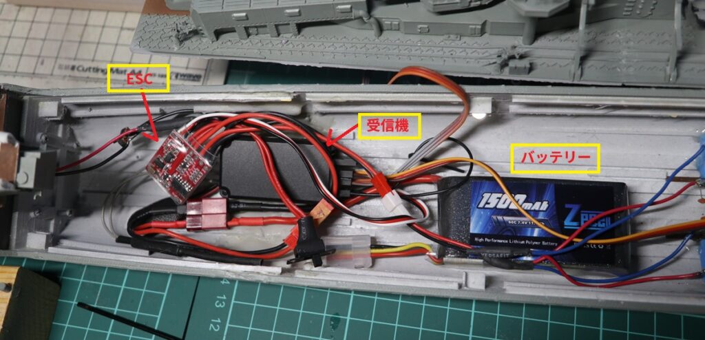 Internal RC setup of 1/150 scale destroyer Yukikaze with battery, receiver, and ESC installed inside the hull