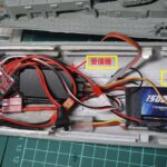 Internal RC setup of 1/150 scale destroyer Yukikaze with battery, receiver, and ESC installed inside the hull