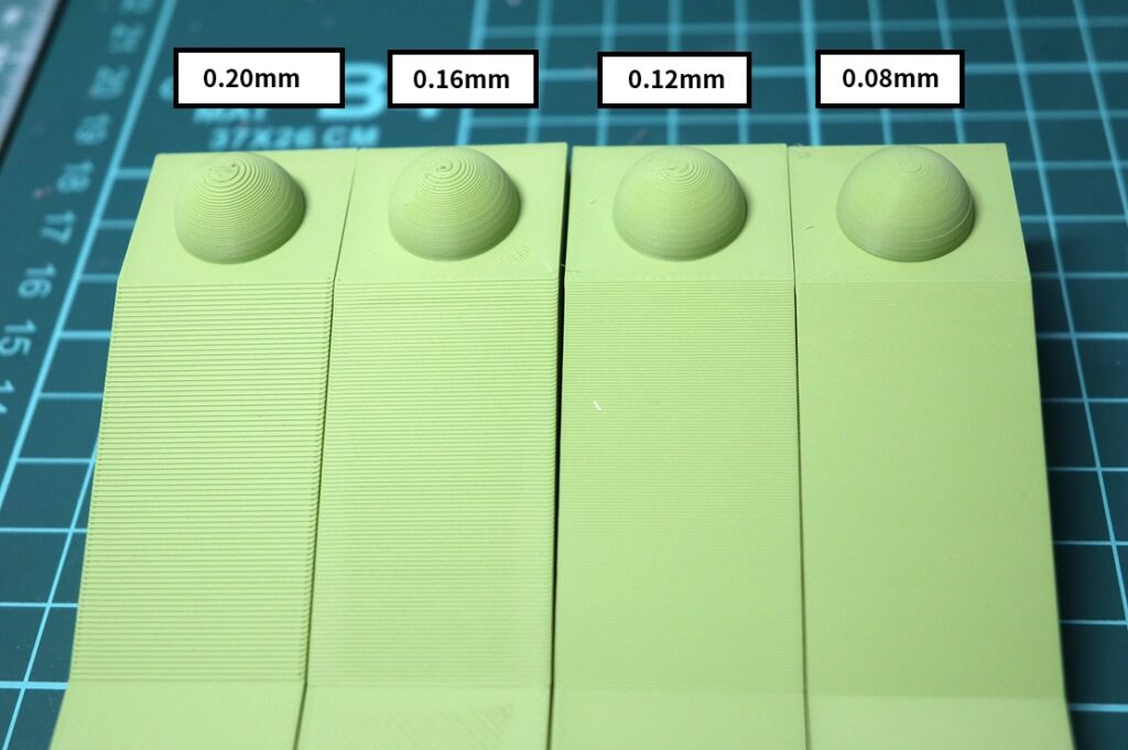 Comparison of FDM layer heights 0.20mm, 0.16mm, 0.12mm, and 0.08mm using a test piece with a slope and dome to show differences in surface finish
