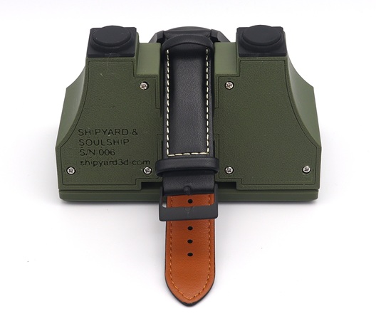 Rear view of the Zuiun watch stand showing the leather strap placement