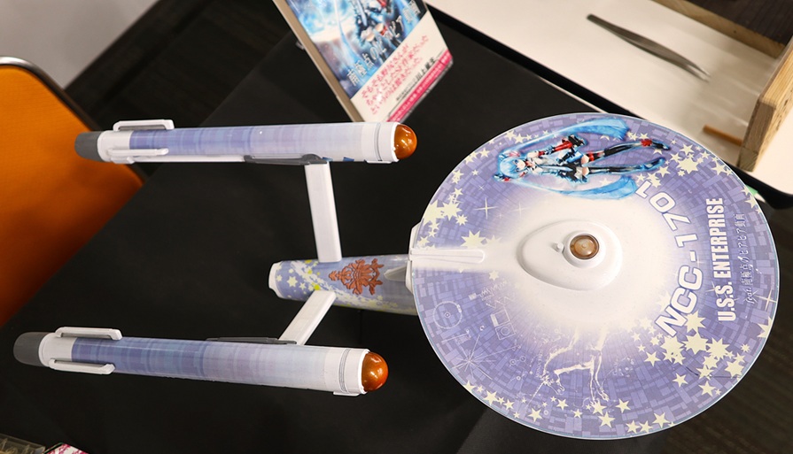 Hatsune Miku themed USS Enterprise NCC-1701 model displayed at Okahobi 2026