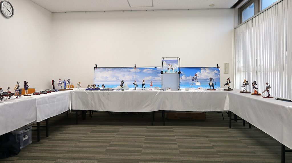 Kantai Collection themed exhibition room at Okahobi 2026 featuring multiple character and ship models